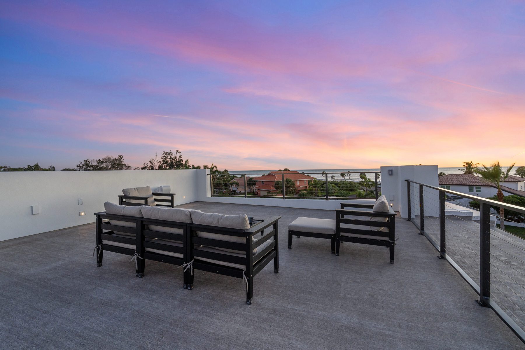 Rooftop terrace at sunset, looking west over the Gulf